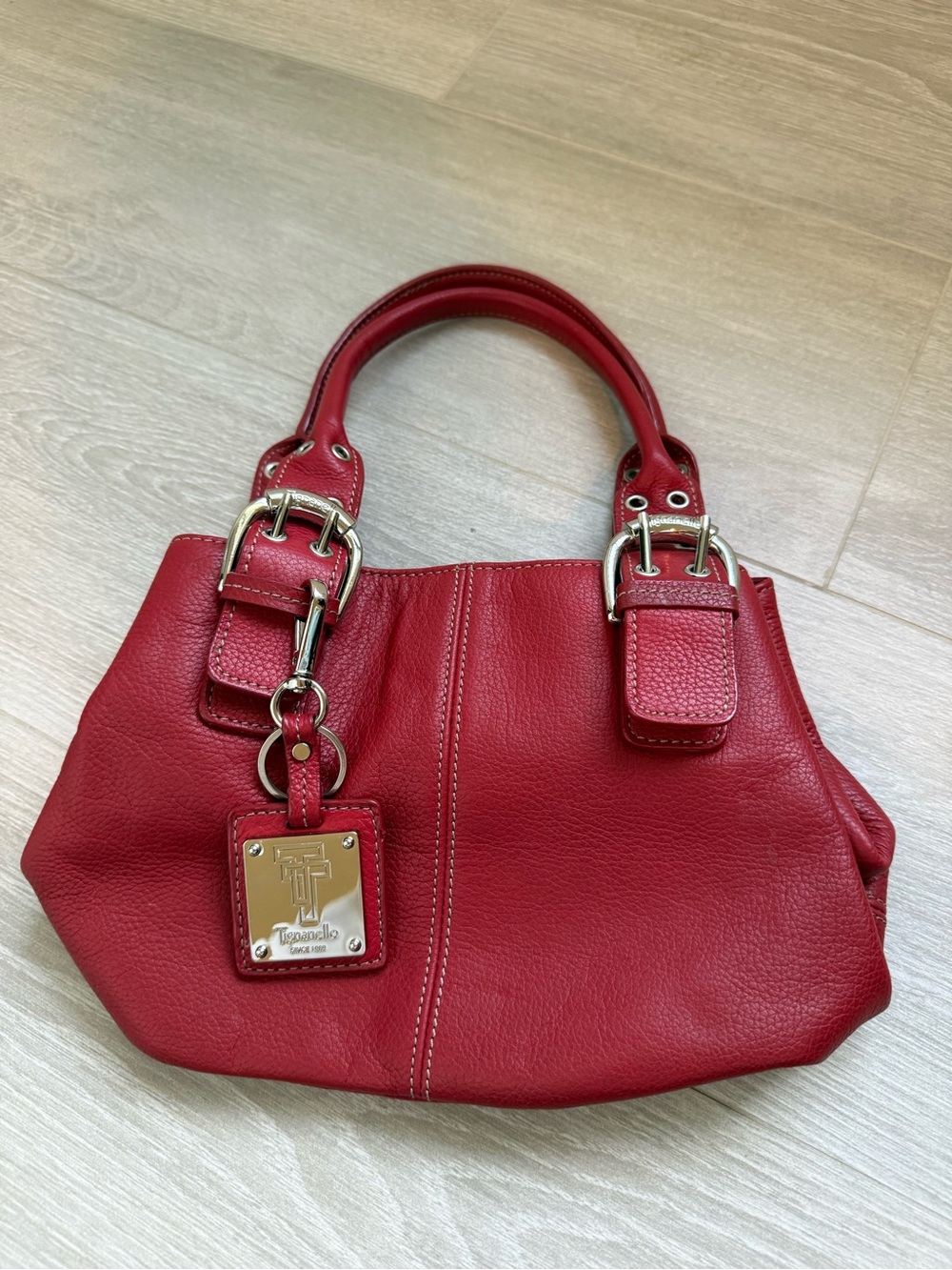Vintage Tignanello red leather handbag with silver hardware